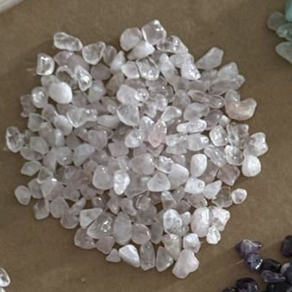 A pile of pale pink rose quartz chips